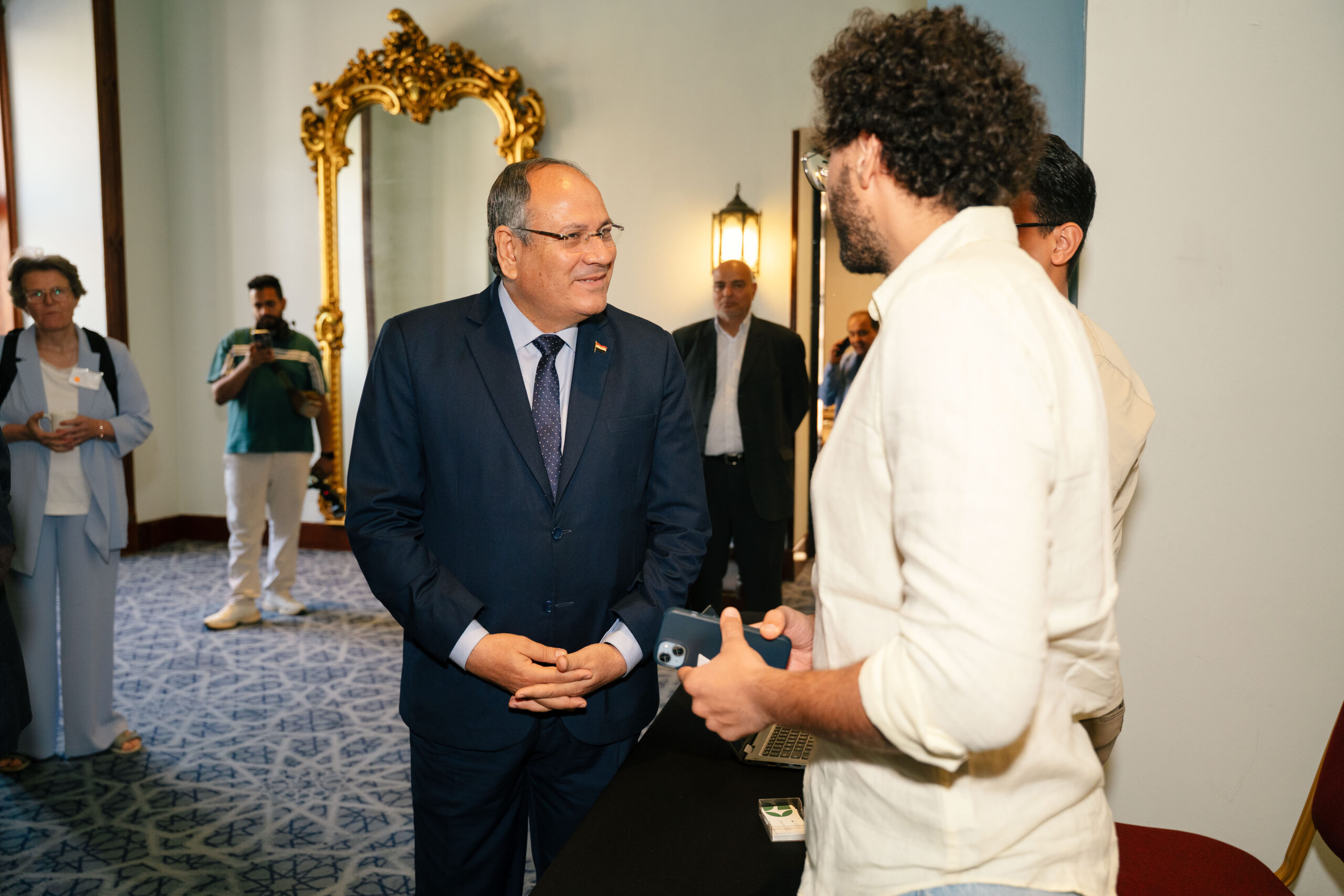 Seif Salama in conversation with a senior official